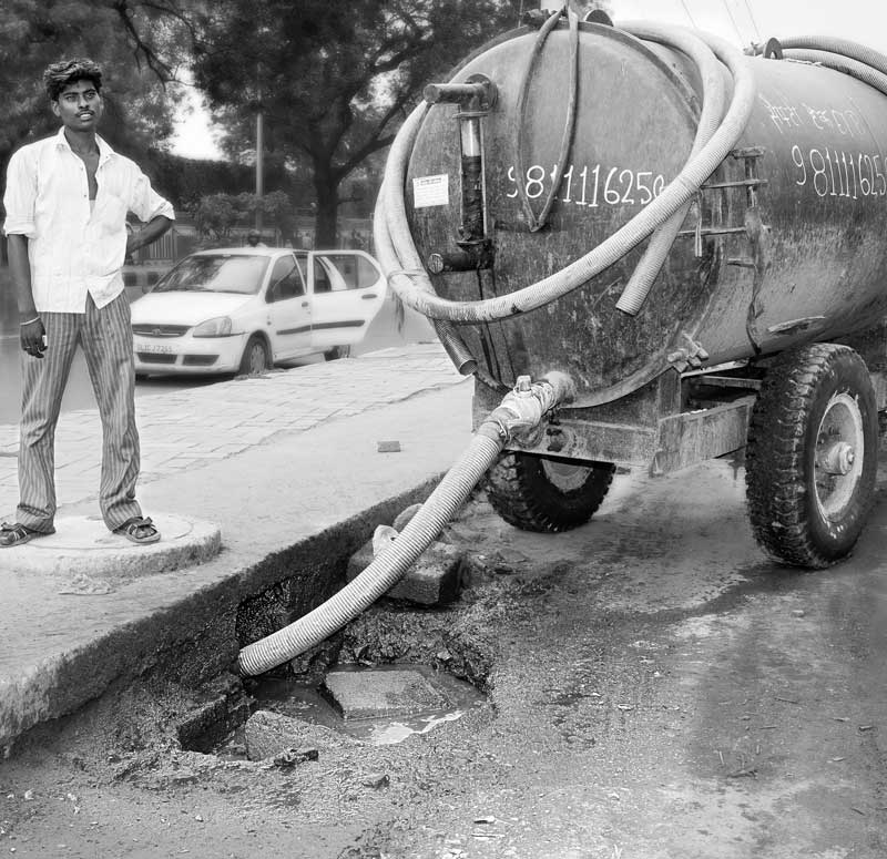 A sewage tanker emptying into a storm water drain in South-East district, National Capital Territory of Delhi, ultimately contributing to pollution of Yamuna river